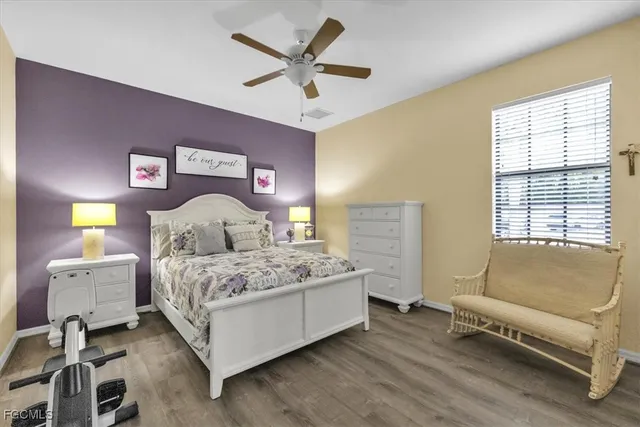 a spacious bedroom with a bed and a couch