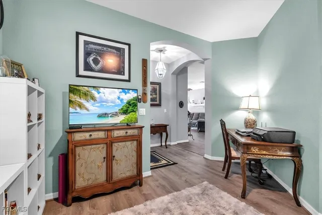 a workspace with furniture and painting on the wall