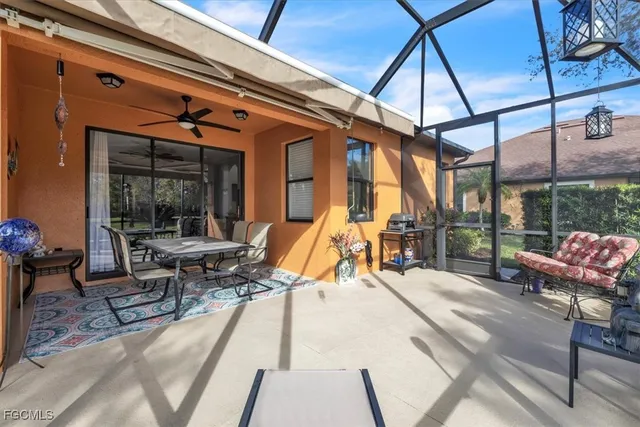 a building outdoor space with patio furniture and potted plants
