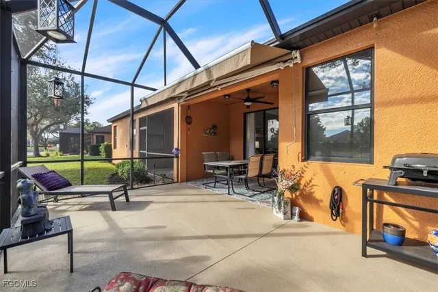 a building outdoor space with seating area and glass door