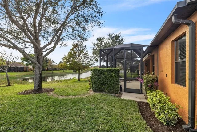a view of a house with a backyard