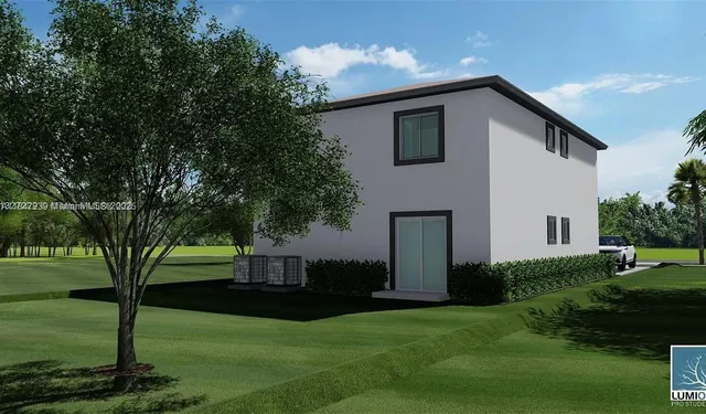a utility room with cabinets washer and dryer
