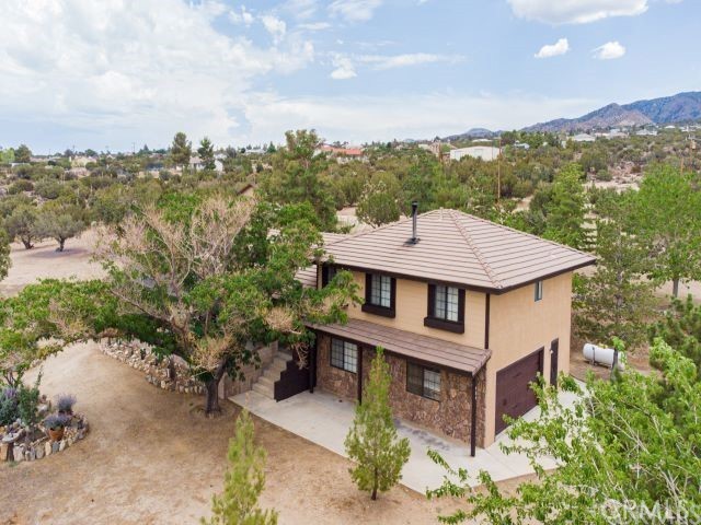 984 Pinon Road Pinon Hills, CA 92372 - Photo 1 of 45 an aerial view of a house with a yard and balcony