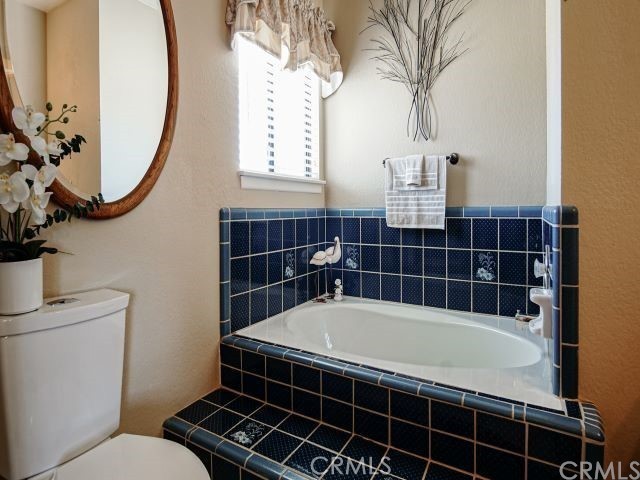 984 Pinon Road Pinon Hills, CA 92372 - Photo 15 of 45 a bathroom with a sink a toilet and a mirror