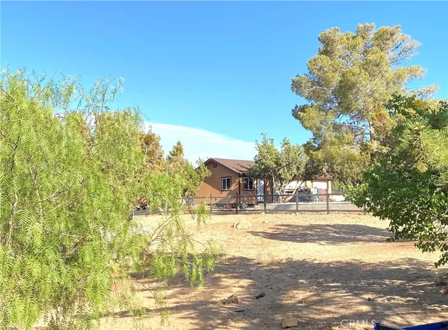 a view of swimming pool with a yard