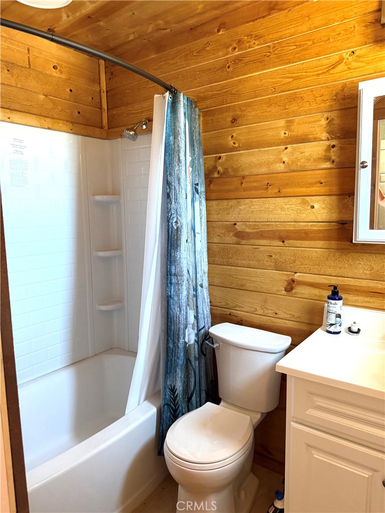 984 Pinon Road Pinon Hills, CA 92372 - Photo 28 of 45 a white toilet sitting next to a bathroom sink and a shower