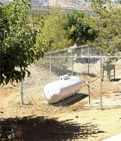 a bathroom with a granite countertop sink and bathtub