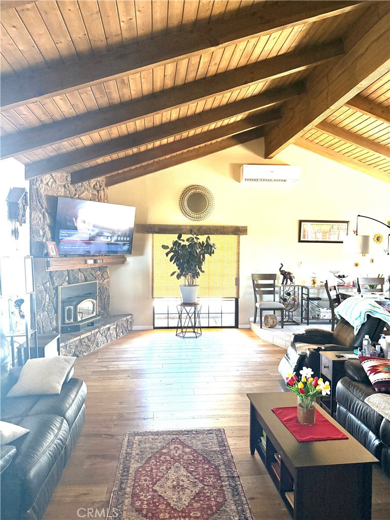 984 Pinon Road Pinon Hills, CA 92372 - Photo 9 of 45 a living room with furniture and a large window