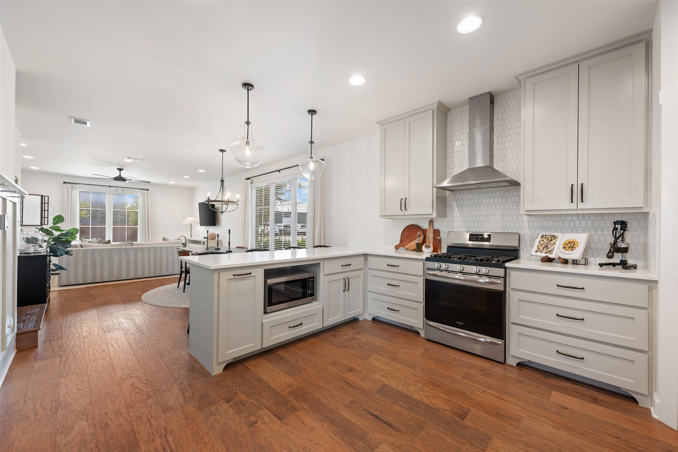 1301 West Street Georgetown, TX 78626 - Photo 15 of 40 Culinary aspirations come alive in this kitchen, featuring sleek stainless steel appliances and an inviting open-concept design.