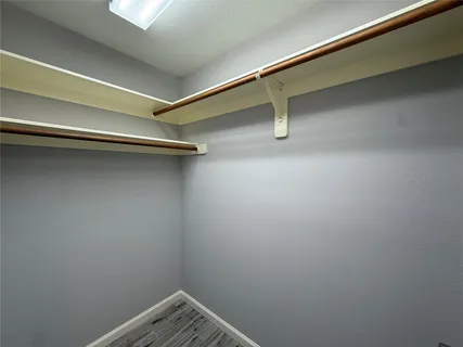 a view of a room with racks on the wall