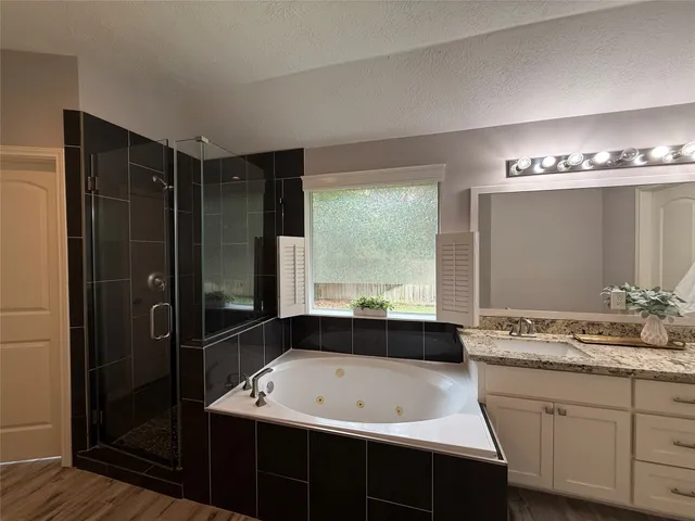 a bathroom with a double vanity sink and mirror