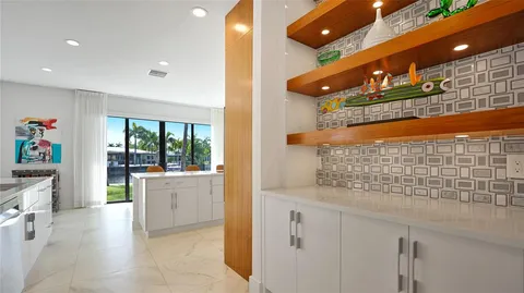 a kitchen with stainless steel appliances granite countertop a sink and cabinets