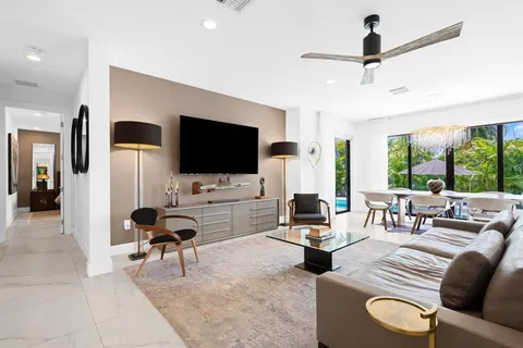 a living room with furniture rug and window