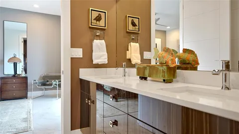 a view of bathroom with dual sinks