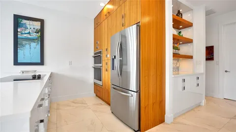 a kitchen with stainless steel appliances granite countertop a sink and cabinets