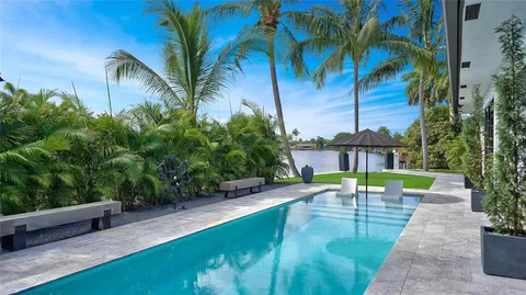 a view of swimming pool with outdoor seating