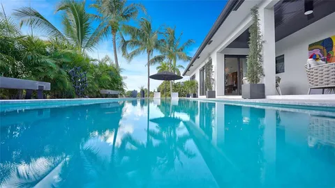 a view of a table and chairs under an umbrella