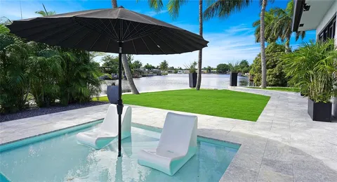 a view of living room with furniture and floor to ceiling window
