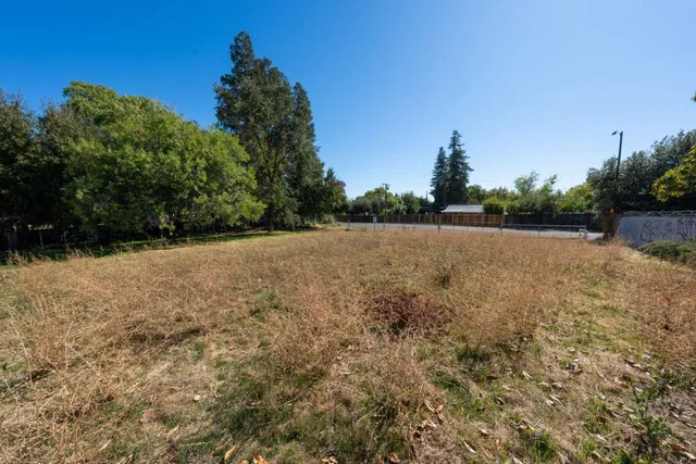 a view of patio with green space
