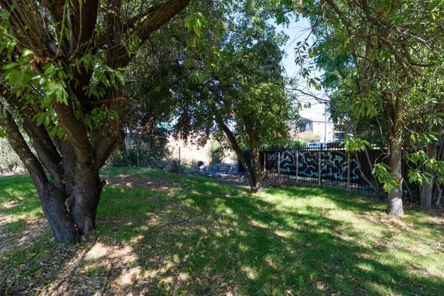 a view of swimming pool with trees in the background