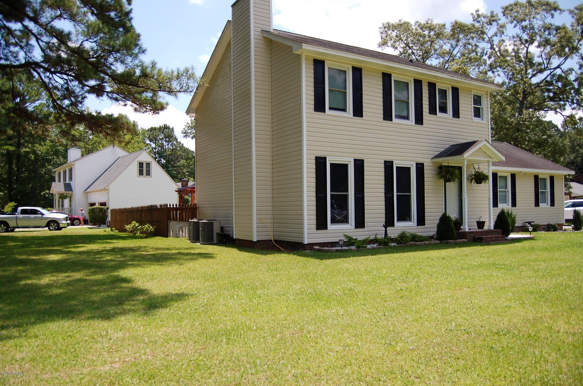 706 Stately Pines Road New Bern, NC 28560 - Photo 1 of 28 Beautiful home on a large lot with in ground pool.