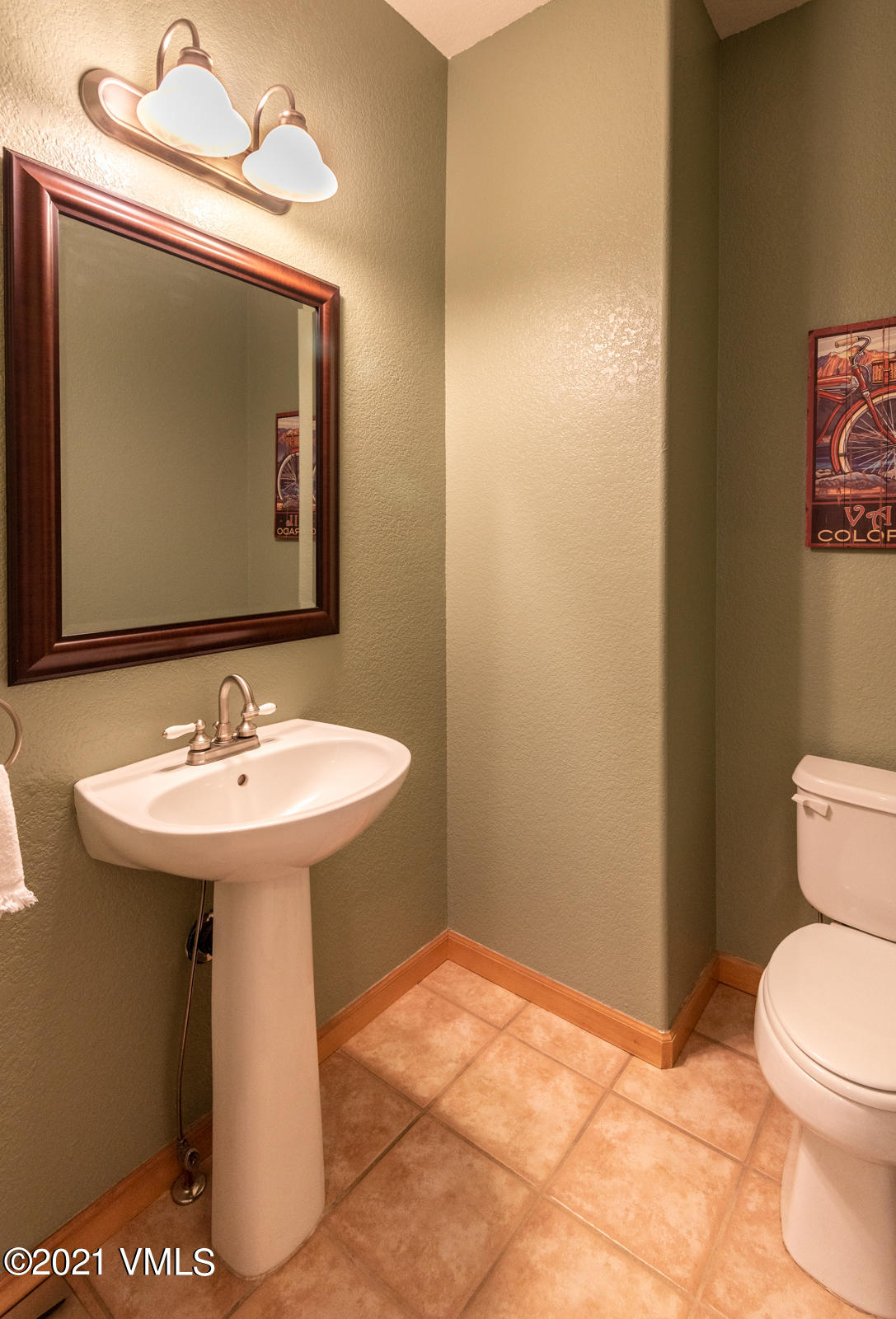 1082 West Wildwood Road, Unit C Avon, CO 81620 - Photo 13 of 30 a bathroom with a sink toilet and mirror