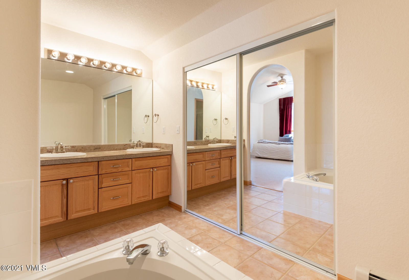 1082 West Wildwood Road, Unit C Avon, CO 81620 - Photo 17 of 30 a spacious bathroom with a granite countertop sink mirror and bathtub