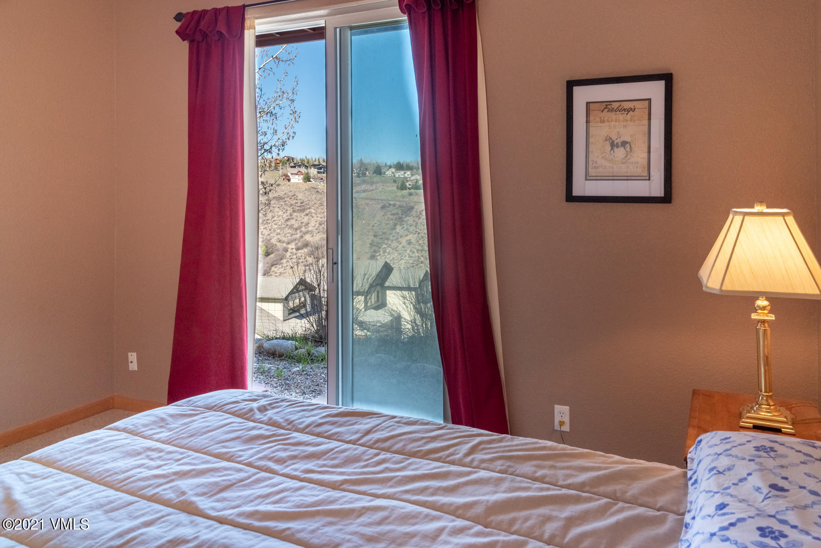 1082 West Wildwood Road, Unit C Avon, CO 81620 - Photo 20 of 30 a bedroom with a bed and a lamp