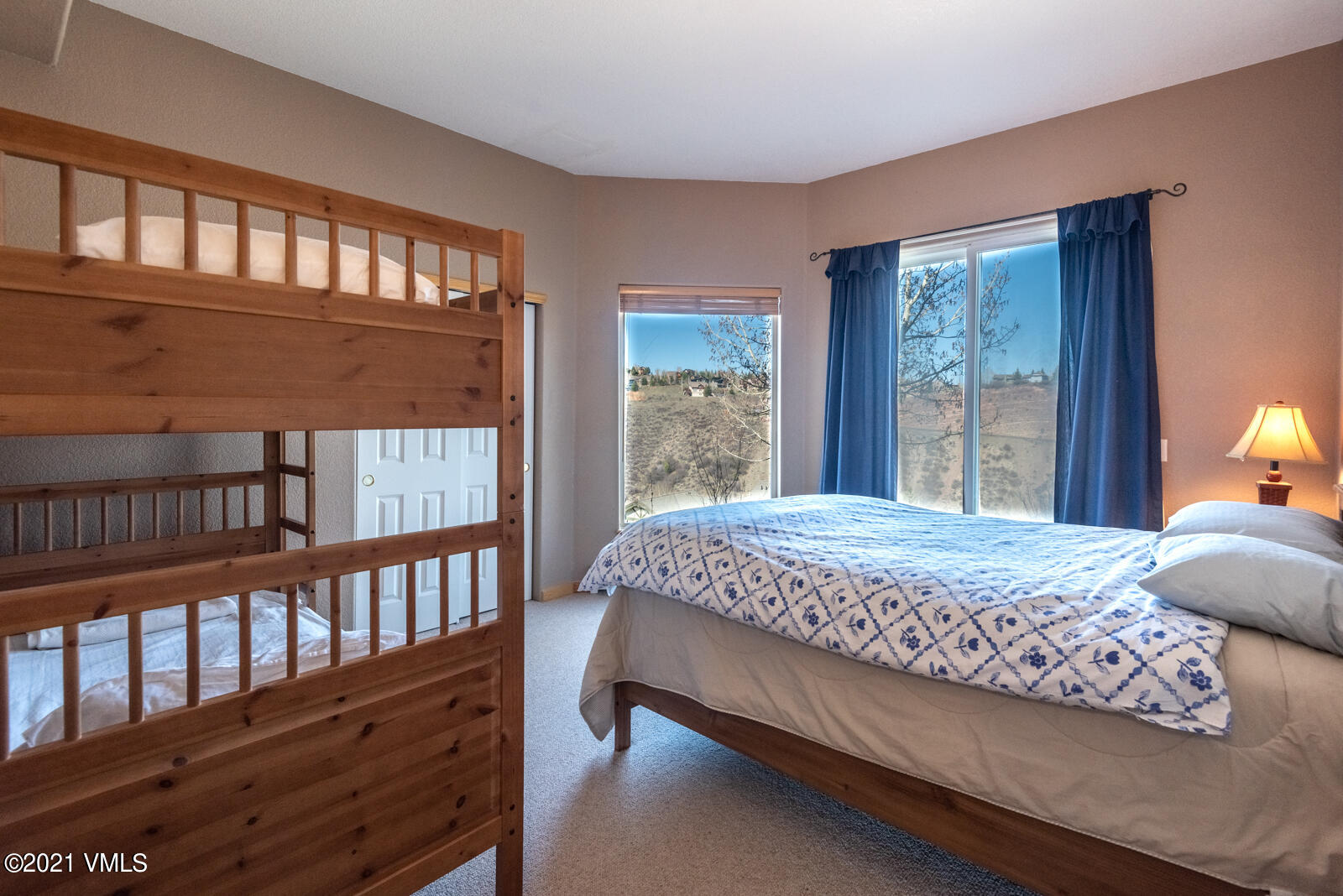 1082 West Wildwood Road, Unit C Avon, CO 81620 - Photo 21 of 30 a bed sitting in a bedroom next to a window