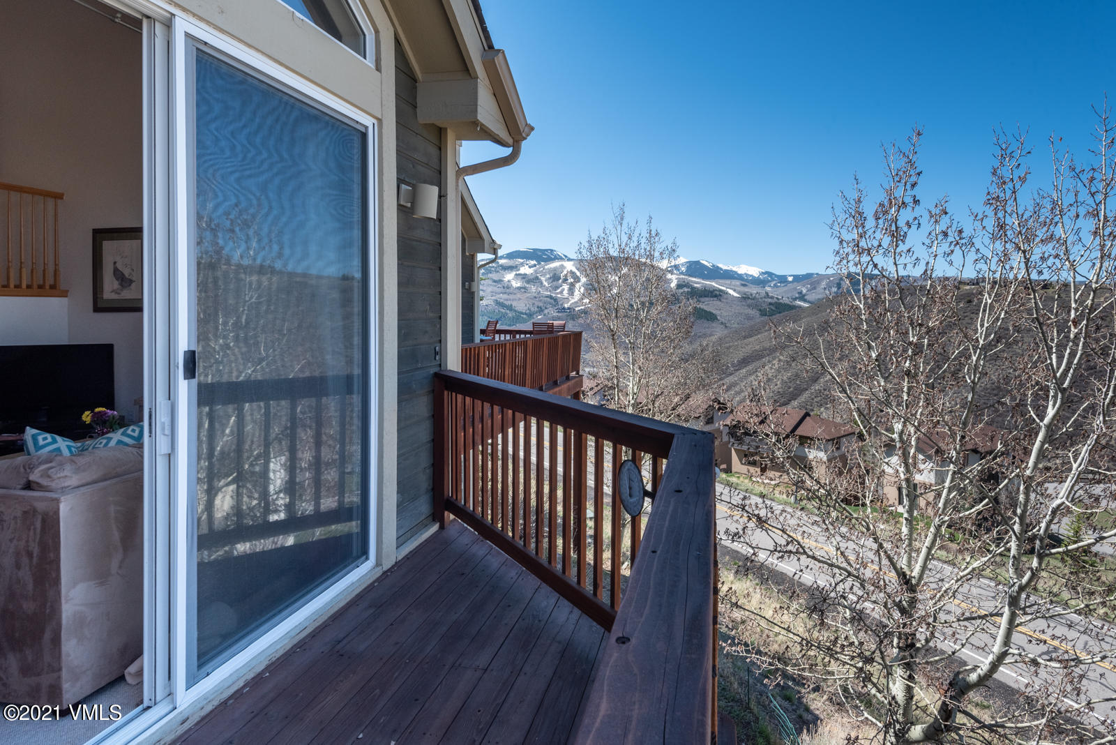 1082 West Wildwood Road, Unit C Avon, CO 81620 - Photo 25 of 30 a view of a balcony with wooden floor and fence