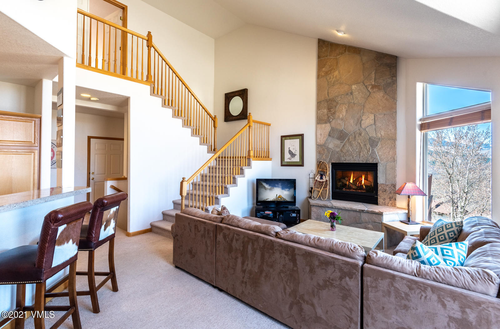 1082 West Wildwood Road, Unit C Avon, CO 81620 - Photo 3 of 30 a living room with furniture and a fireplace