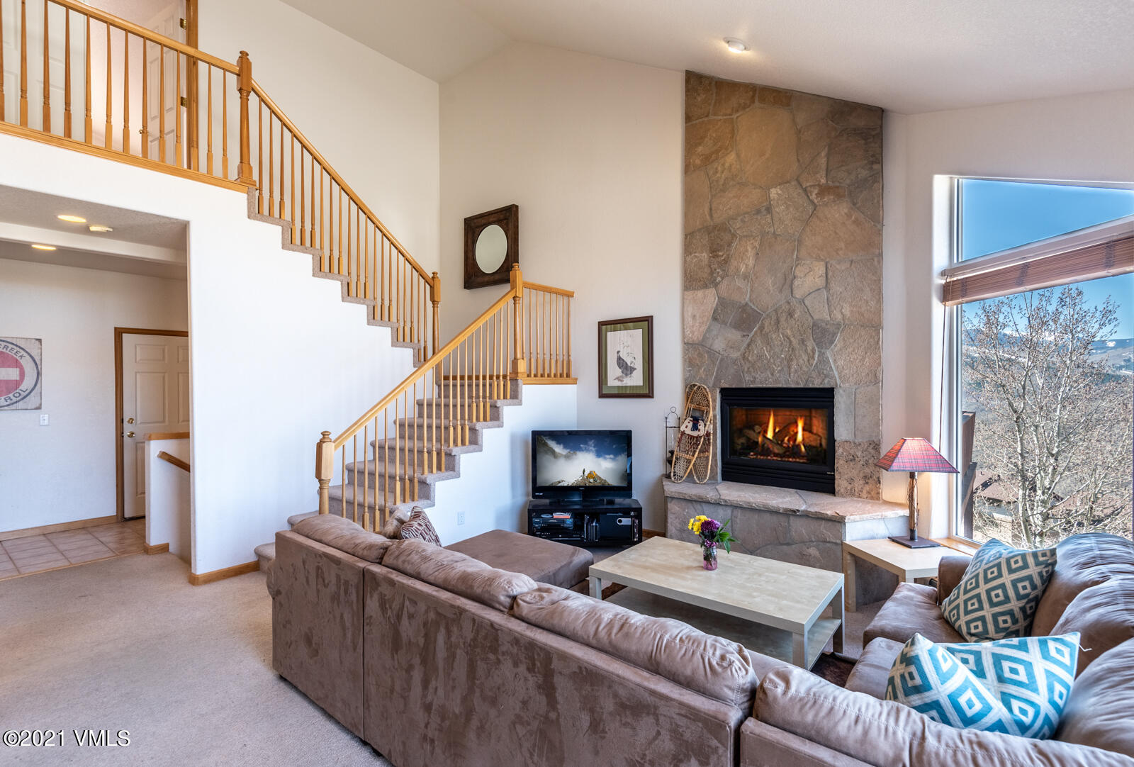 1082 West Wildwood Road, Unit C Avon, CO 81620 - Photo 5 of 30 a living room with furniture and a fireplace