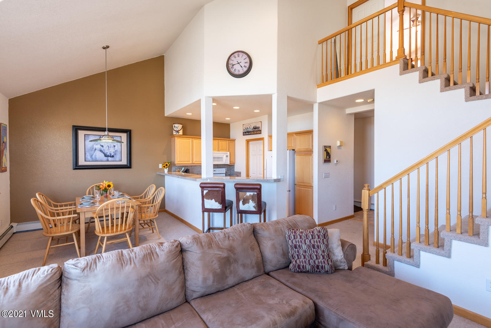 1082 West Wildwood Road, Unit C Avon, CO 81620 - Photo 8 of 30 a living room with furniture wooden floor and a large window