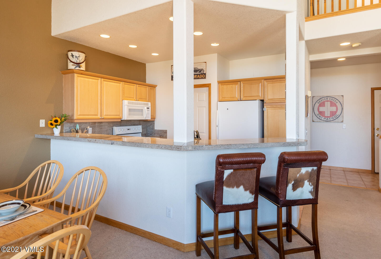1082 West Wildwood Road, Unit C Avon, CO 81620 - Photo 10 of 30 a dining room with furniture and window