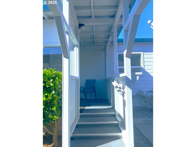 a view of balcony with furniture