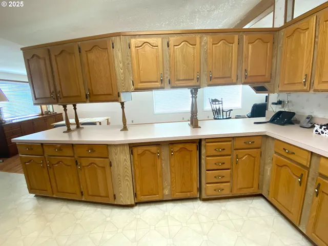 a kitchen with a sink cabinets and appliances