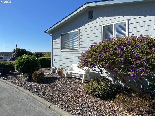 a view of a backyard with sitting area