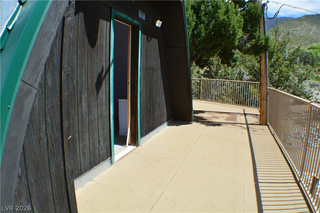 1321 Trout Canyon Road Las Vegas, NV 89124 - Photo 39 of 50 A spacious outdoor deck with sturdy railings, ideal for mountain view enjoyment.