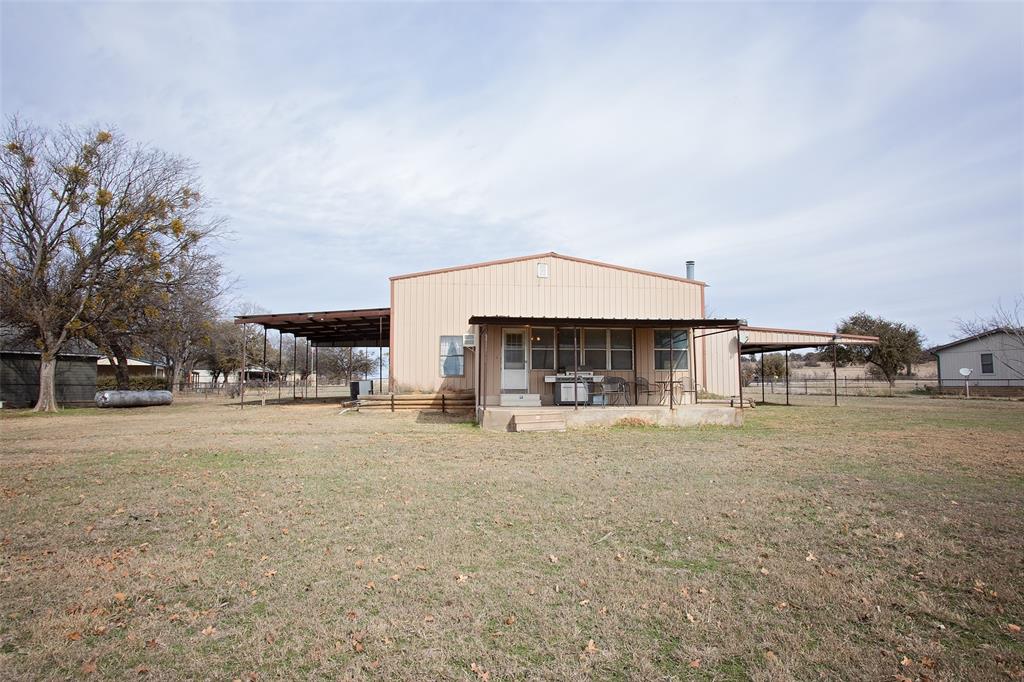 1193 Eastside Lake Road Graham, TX 76450 - Photo 7 of 38 a view of a house with a yard