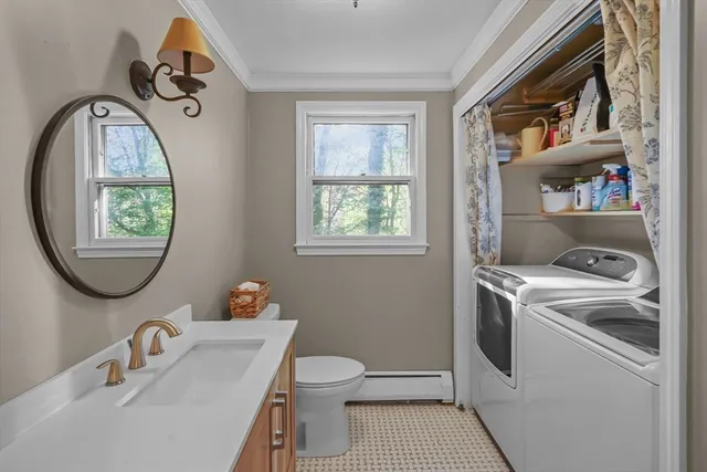 a bathroom with a toilet a sink and a mirror