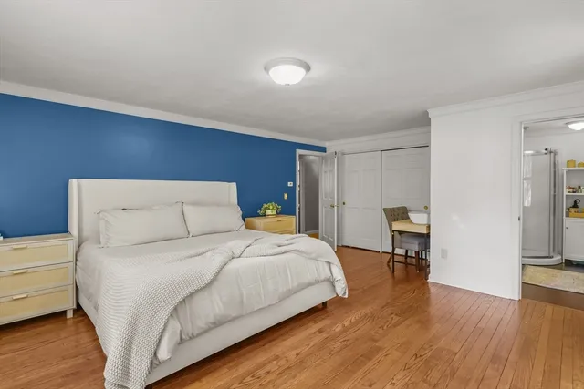 a bedroom with a bed and a table in it