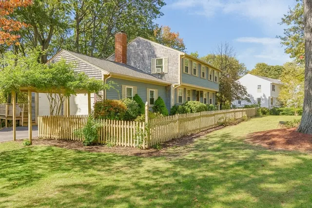 a view of a house with a yard and plants