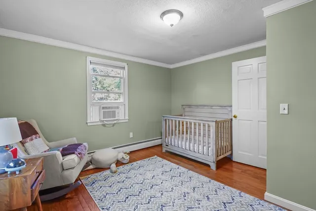 a bedroom with furniture and a window