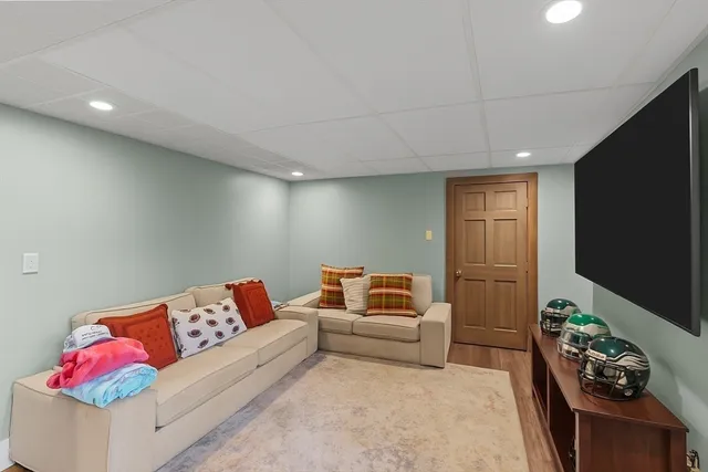 a living room with furniture and flowers