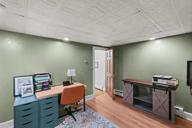 a room with furniture and a wooden floor