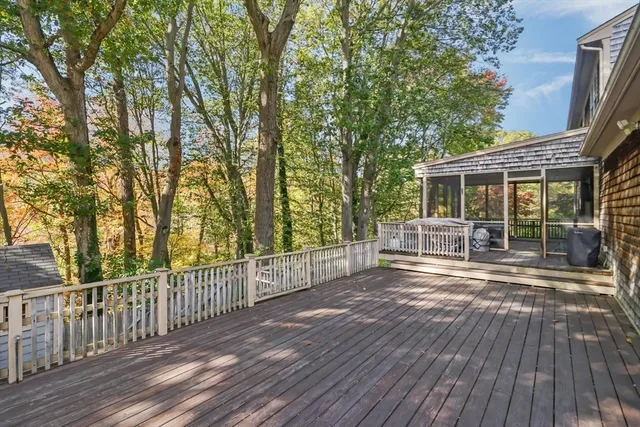 a view of house with backyard and wooden floor