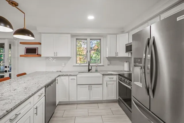 a kitchen with a sink stove and refrigerator