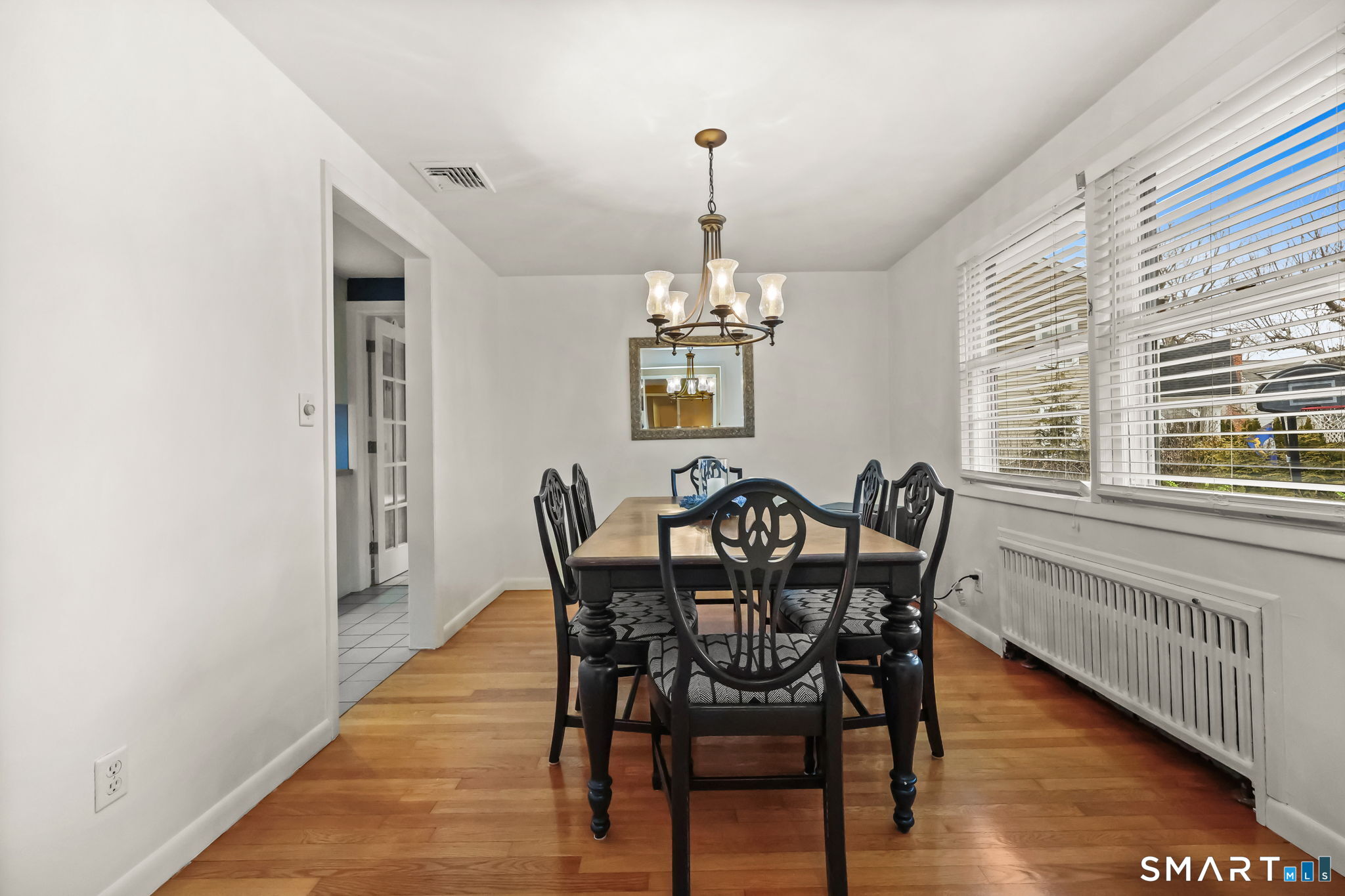 19 Lyncrest Drive Norwalk, CT 06851 - Photo 18 of 41 a view of a dining room with furniture window and wooden floor