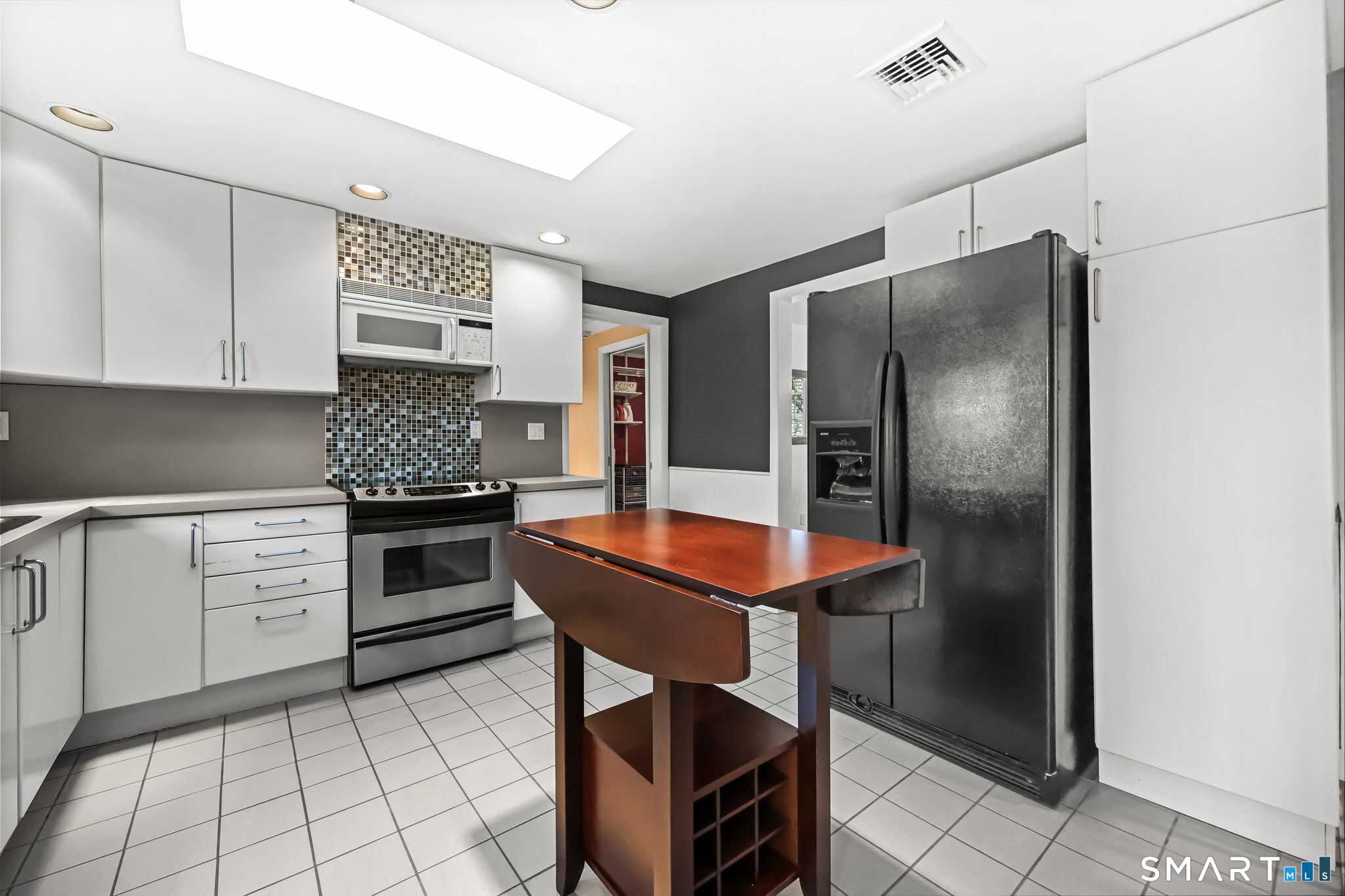 19 Lyncrest Drive Norwalk, CT 06851 - Photo 21 of 41 a kitchen with stainless steel appliances granite countertop a refrigerator sink and stove