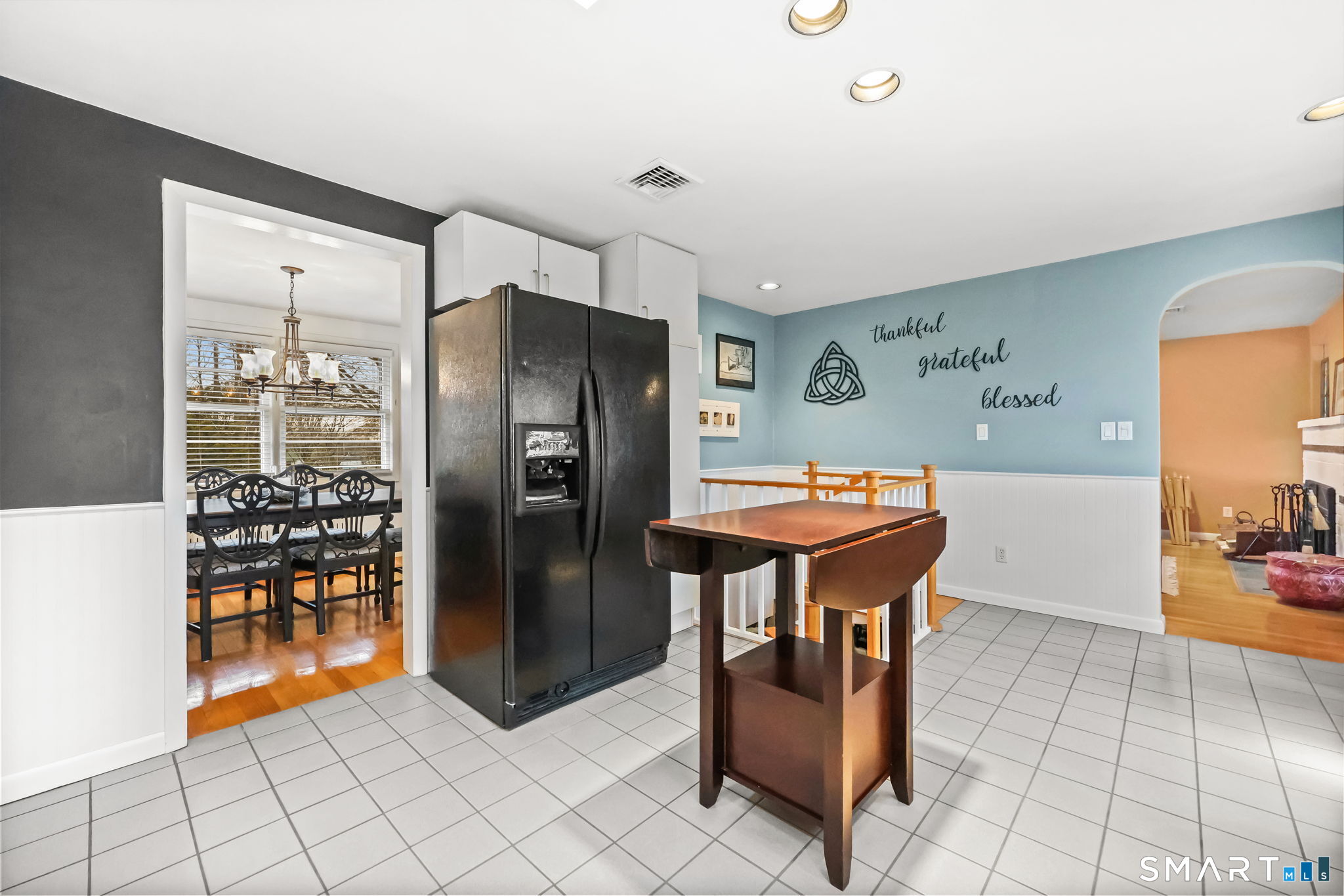 19 Lyncrest Drive Norwalk, CT 06851 - Photo 22 of 41 a kitchen with stainless steel appliances kitchen island granite countertop a refrigerator and a sink